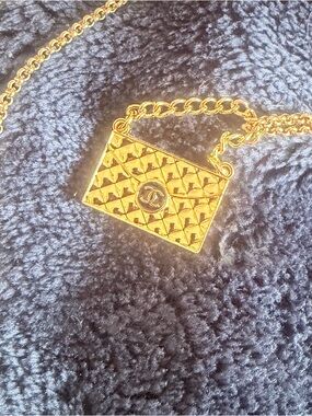 Purse charm with Chanel logo. Chain included.